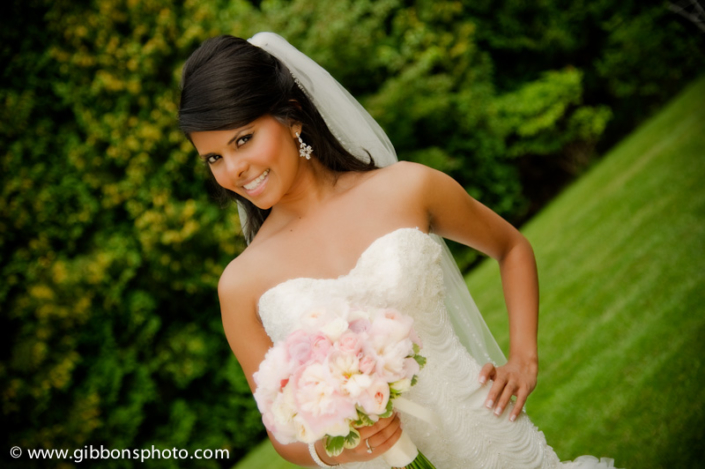 A beautiful bride in a wedding dress posing for a photo.