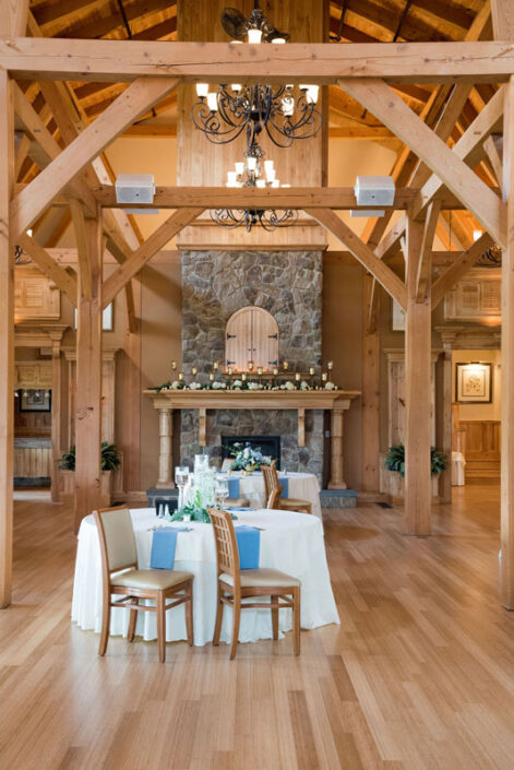 A large room with wooden beams and a wooden floor.