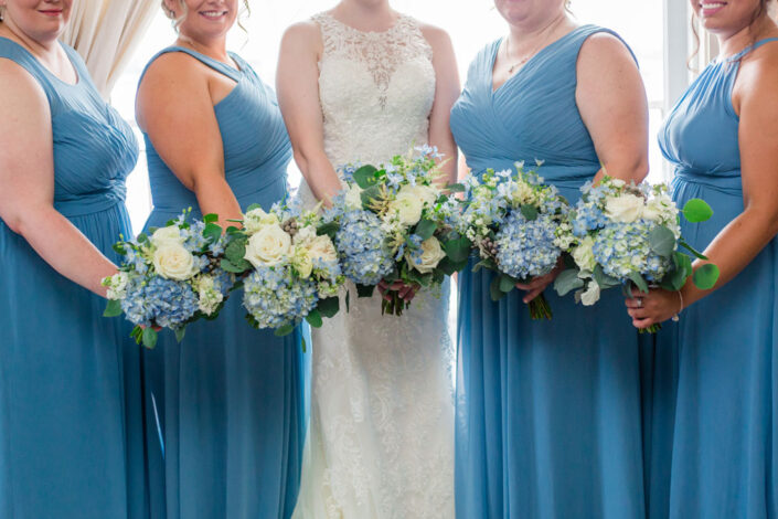 Bridesmaids in Blue Dresses in Nick and Rachel Wedding