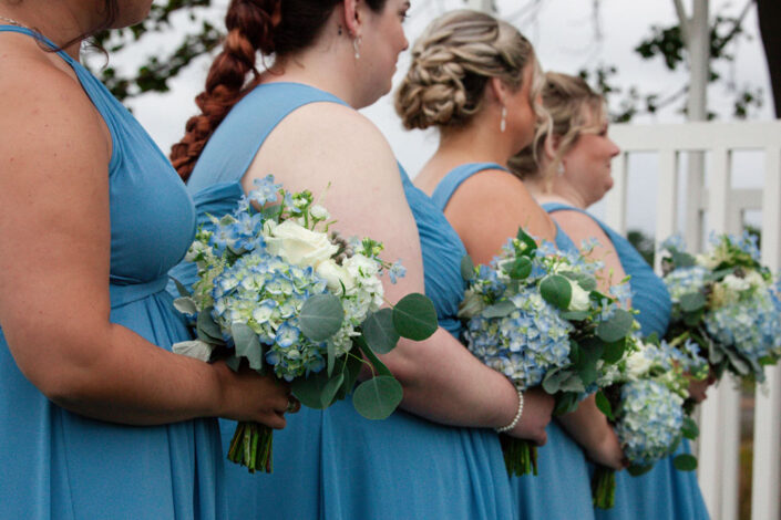 Bridesmaids in Blue Dresses and White Floral