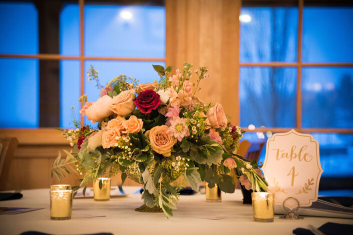 A table setting with flowers and candles.