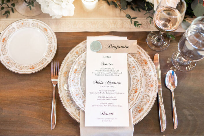 A table setting with plates and silverware.
