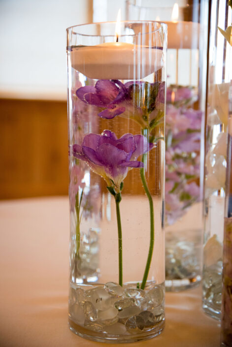 glass candles with purple color flowers