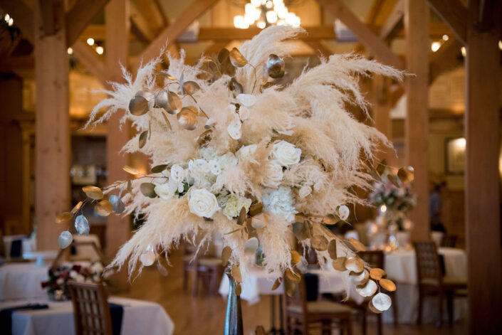 An arrangement of feathers in a wooden table.