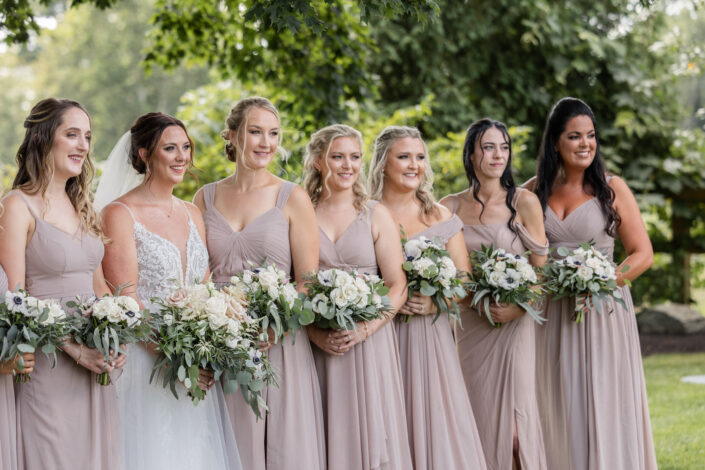 Bridesmaids with Distinct Floral Designs by Anne Marshall