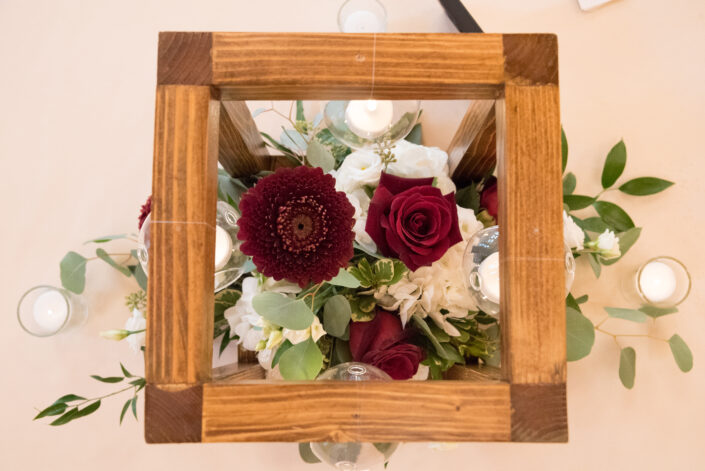 An arrangement of flowers in a wooden box.