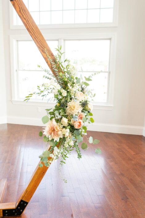 wooden frame with flowers in white room