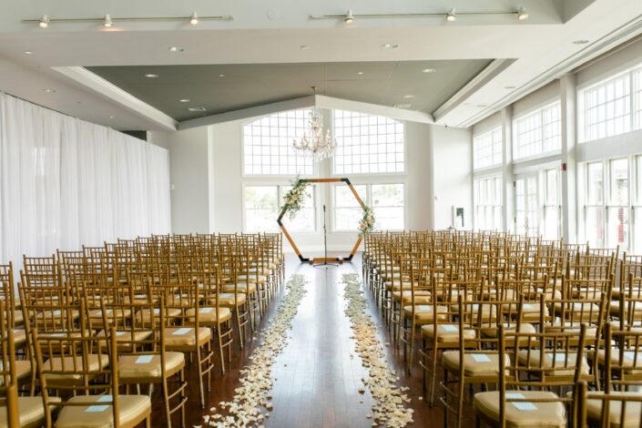 wedding hall with chairs and flower petals