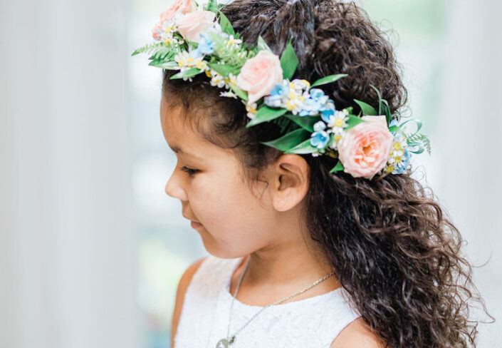 closeup of a girl wearing a flower tiara